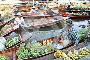 AMPHAWA Ã¢â¬â APRIL 29: Wooden boats are loaded with fruits from the orchards at Tha kha floating market
